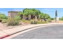 Inviting home exterior with mature trees and desert landscaping at 1338 W Mountain View Dr, Mesa, AZ 85201