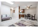 Open-concept living room with view to the kitchen and dining area at 14300 W Bell Rd # 100, Surprise, AZ 85374