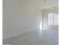 Bright dining room with elegant chandelier, perfect for gatherings at 16367 W Desert Mirage Dr, Surprise, AZ 85388