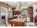 Gourmet kitchen featuring stainless steel appliances, granite countertops, and ample cabinetry at 20139 E Via Del Oro --, Queen Creek, AZ 85142