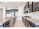 Open kitchen with granite countertops, stainless appliances and plenty of cabinet space at 20234 W Catalina Dr, Buckeye, AZ 85396