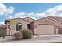 Charming single-story home with low-maintenance desert landscaping and a neutral color palette at 23637 W Hopi St, Buckeye, AZ 85326