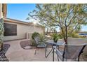 Inviting flagstone patio with seating and desert landscaping at 2462 W Turtle Hill Dr, Anthem, AZ 85086