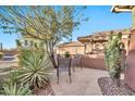 Inviting flagstone patio with seating and desert landscaping at 2462 W Turtle Hill Dr, Anthem, AZ 85086
