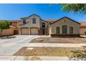 Charming home with a three-car garage and lush desert landscaping, complete with a private gated courtyard at 2718 S Cupertino Dr, Gilbert, AZ 85295