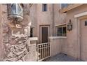Inviting front entryway featuring a gate, stone accents, and a cozy, welcoming atmosphere at 2856 E Desert Broom Pl, Chandler, AZ 85286