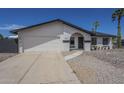 Lovely home with desert landscaping, complemented by a spacious driveway and attached two-car garage at 3722 W Michelle Dr, Glendale, AZ 85308