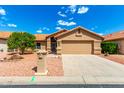 Inviting single-story home with a well-manicured front yard and a convenient two-car garage at 3971 N 151St Ln, Goodyear, AZ 85395