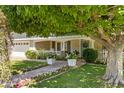 Charming front entrance with a stone pathway lined with colorful flowers at 4111 N 52Nd St, Phoenix, AZ 85018