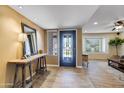 Bright foyer featuring stylish flooring, and a view into other living spaces at 4418 E Paradise Ln, Phoenix, AZ 85032