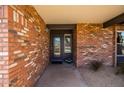 Close-up of the inviting brick entryway with the front door at 4418 E Paradise Ln, Phoenix, AZ 85032
