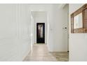 Bright hallway with tile floors and access to various rooms, leading to front door at 4535 E Navigator Ln, Phoenix, AZ 85050