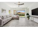 Bright living room featuring a comfortable sofa, large sliding glass doors and stylish accents at 4535 E Navigator Ln, Phoenix, AZ 85050