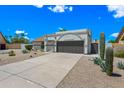 Charming single-story home boasting desert landscaping and a two car garage at 4902 E Golden St, Mesa, AZ 85205