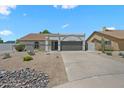 Charming single-story home boasting desert landscaping and a two car garage at 4902 E Golden St, Mesa, AZ 85205