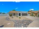 Charming single-story home boasting desert landscaping and a two car garage at 4902 E Golden St, Mesa, AZ 85205