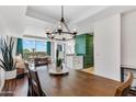 Spacious dining room featuring a large wood table, bright light fixture and views of the city at 6803 E Main St # 5503, Scottsdale, AZ 85251