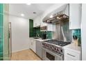 Modern kitchen with stainless steel appliances, white cabinets, and stylish backsplash tiles at 6803 E Main St # 5503, Scottsdale, AZ 85251