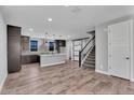 Open-concept kitchen flows into the living space, perfect for entertaining and modern living at 687 W Flintlock Way, Chandler, AZ 85286