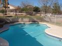 Sparkling pool with a view of the backyard in this well-maintained outdoor oasis at 7176 W Blackhawk Dr, Glendale, AZ 85308
