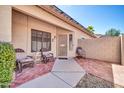 Welcoming outdoor patio area with comfortable seating and lovely landscaping, perfect for relaxation at 8921 W Laurel Ln, Peoria, AZ 85345