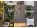 An aerial view showcases the expansive yard, patio, garden and landscaping of the home at 11530 E Vine Ave, Mesa, AZ 85208