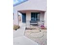 Inviting front porch area with desert landscaping, metal railing and covered porch at 1616 W Burgess Ln, Phoenix, AZ 85041