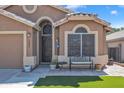 Attractive home exterior with stone accents, a charming front bench, and well-kept landscaping, showing street view at 18845 N 23Rd Pl, Phoenix, AZ 85024
