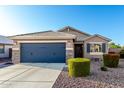 Charming single-Gathering home featuring a two-car garage and desert landscaping at 2070 E Saddlebrook Ct, Gilbert, AZ 85298