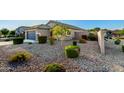 Well-maintained front yard with desert landscaping and healthy green bushes at 2070 E Saddlebrook Ct, Gilbert, AZ 85298