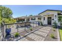 Inviting front patio with comfortable seating and stylish landscaping with pavers and plants at 3029 E Elm St, Phoenix, AZ 85016