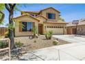 Inviting two-story home featuring desert landscaping in the front yard at 32901 N Hidden Canyon Dr, San Tan Valley, AZ 85144