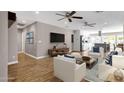 Bright living room with ceiling fans, modern furnishings, and hardwood floors offers a relaxing space at 4216 N 20Th St, Phoenix, AZ 85016