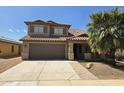 Inviting home with a tile roof, two-car garage, and a mature palm tree in the front yard at 42435 W Desert Fairways Dr, Maricopa, AZ 85138