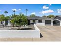 Beautiful single-story house with a well-maintained front yard and an inviting facade at 5320 E Thomas Rd, Phoenix, AZ 85018