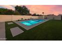 Enjoy this refreshing pool surrounded by green turf and tasteful landscaping, creating a private outdoor oasis at 9013 E Shooting Star Dr, Gold Canyon, AZ 85118