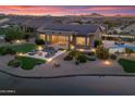 Striking home with solar panels, covered patio, a firepit, and a refreshing pool at 16683 S 180Th Dr, Goodyear, AZ 85338