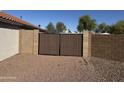 Back yard wooden gate for back yard access and fenced in yard at 1120 S Valley Dr, Apache Junction, AZ 85120