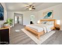 A bright, spacious primary bedroom with a ceiling fan and modern decor at 1274 W Dexter Way, San Tan Valley, AZ 85143
