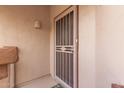 Neutral color exterior with tan accents to the metal screen door at 16801 N 94Th St # 2056, Scottsdale, AZ 85260