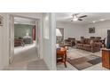 The open-concept living room and bedroom area features carpeted floors at 16801 N 94Th St # 2056, Scottsdale, AZ 85260