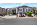Charming house with a golf cart, a covered driveway, and landscaping at 17200 W Bell Rd # 1748, Surprise, AZ 85374