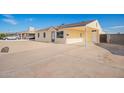 Single-story home with a covered carport and spacious driveway at 2037 W Wood Dr, Phoenix, AZ 85029