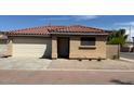 Charming single-story home showcasing a well-maintained front yard with a neutral desert landscape at 2358 E Peach Tree Dr, Chandler, AZ 85249