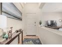 Welcoming entryway features a decorative console table and an inviting rug at 2989 N 44Th St # 3044, Phoenix, AZ 85018