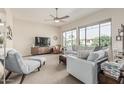 Bright living room with ample natural light, comfortable seating, and modern entertainment center at 2989 N 44Th St # 3044, Phoenix, AZ 85018