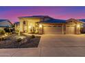 Charming home featuring desert landscaping, concrete driveway, and a two-car garage at 30026 N 47Th St, Cave Creek, AZ 85331