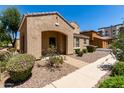 Inviting home exterior with desert landscaping, sidewalk, and covered entryway at 3020 E Megan St, Gilbert, AZ 85295