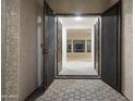 Grand entryway featuring double doors leading into a bright, open living space at 3551 W Hidden Mountain Ln, Anthem, AZ 85086