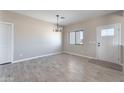 Entryway with wood-look tile flooring, neutral paint, and natural light at 3887 S 331St Ave, Tonopah, AZ 85354